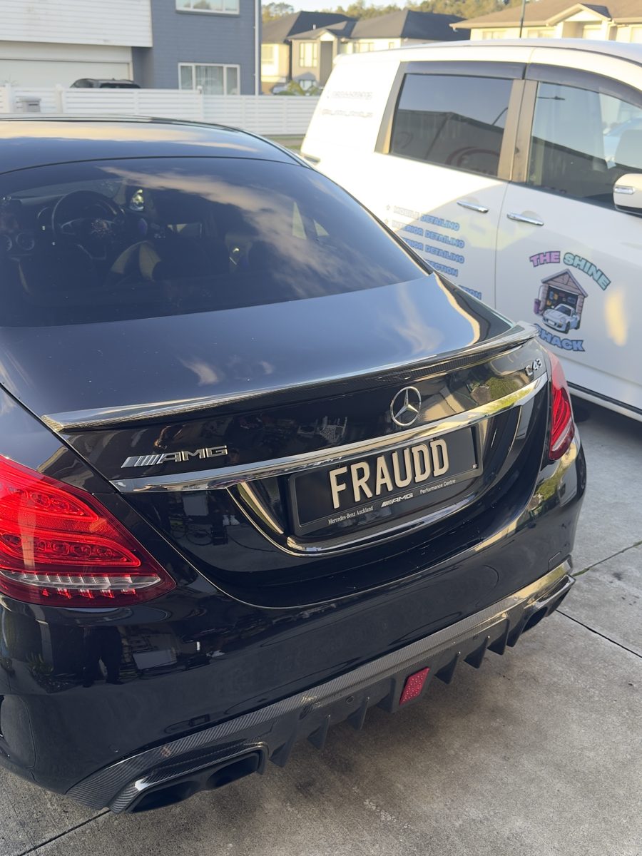 Black Mercedes-Benz C43 AMG rear, with Shine Shack van
