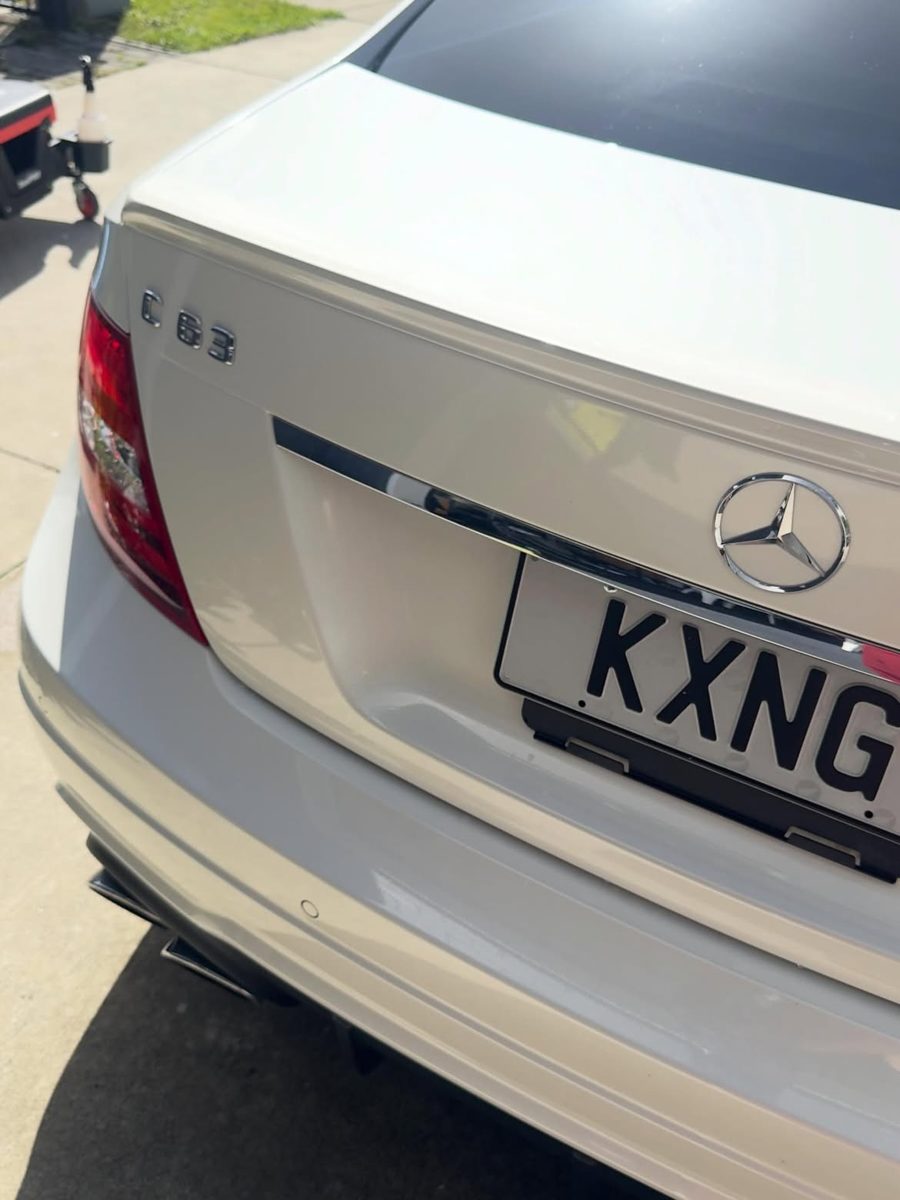 White Mercedes-Benz C63 AMG rear, after detail