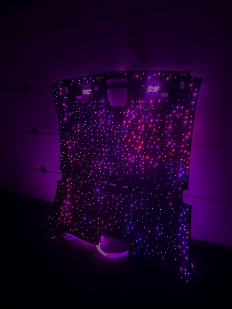 Starlight headliner glowing purple, close-up