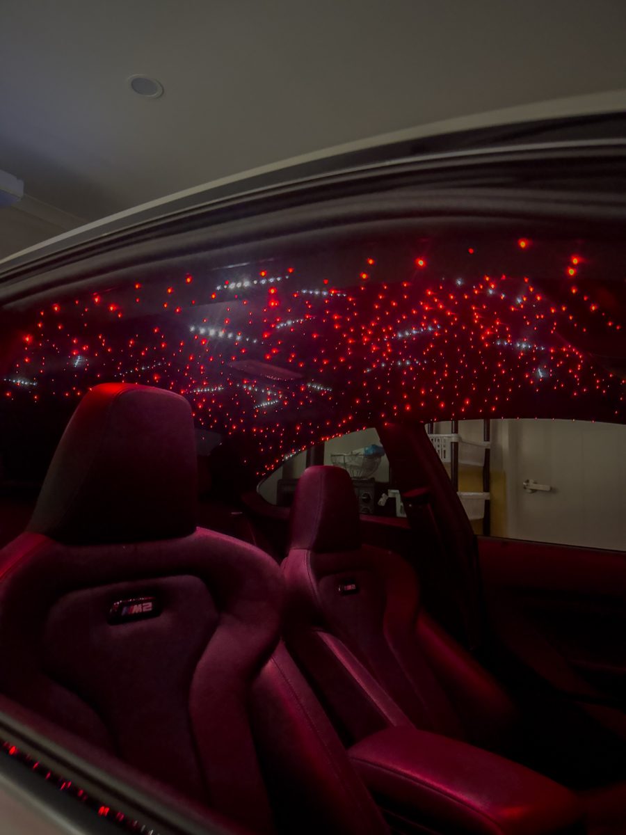 BMW M2 interior with red starlight headliner